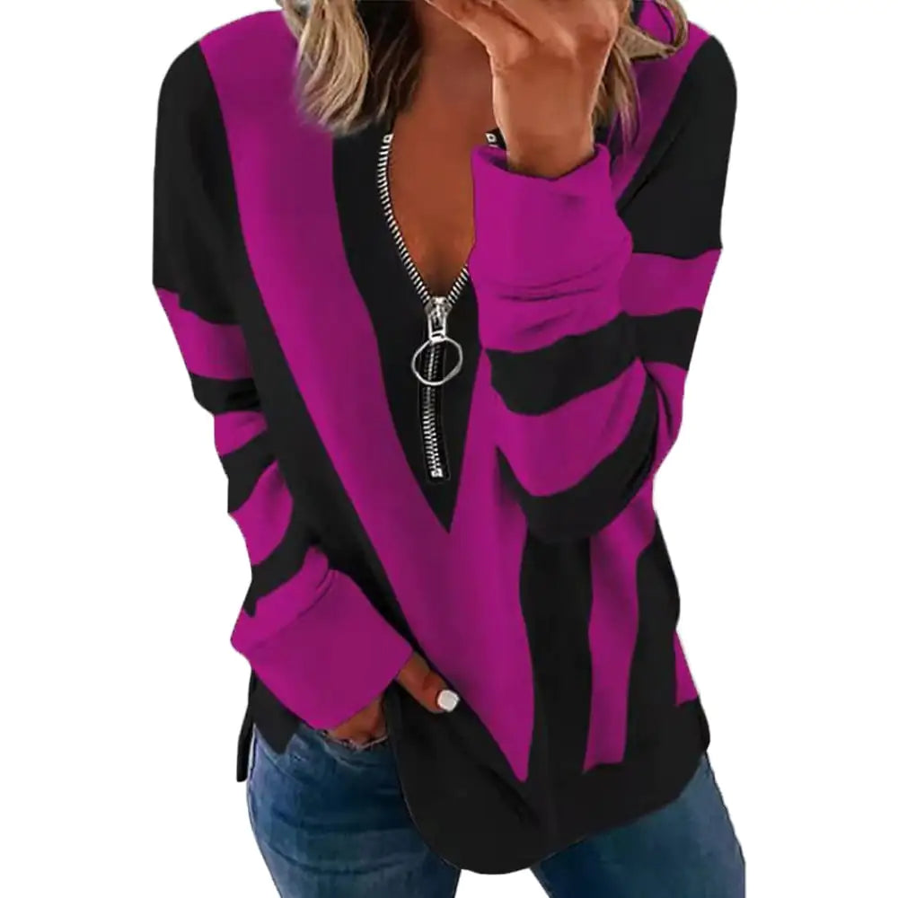 A woman wearing a long-sleeved, striped V-neck sweatshirt with a functional front zipper, available in purple or grey with black accents.