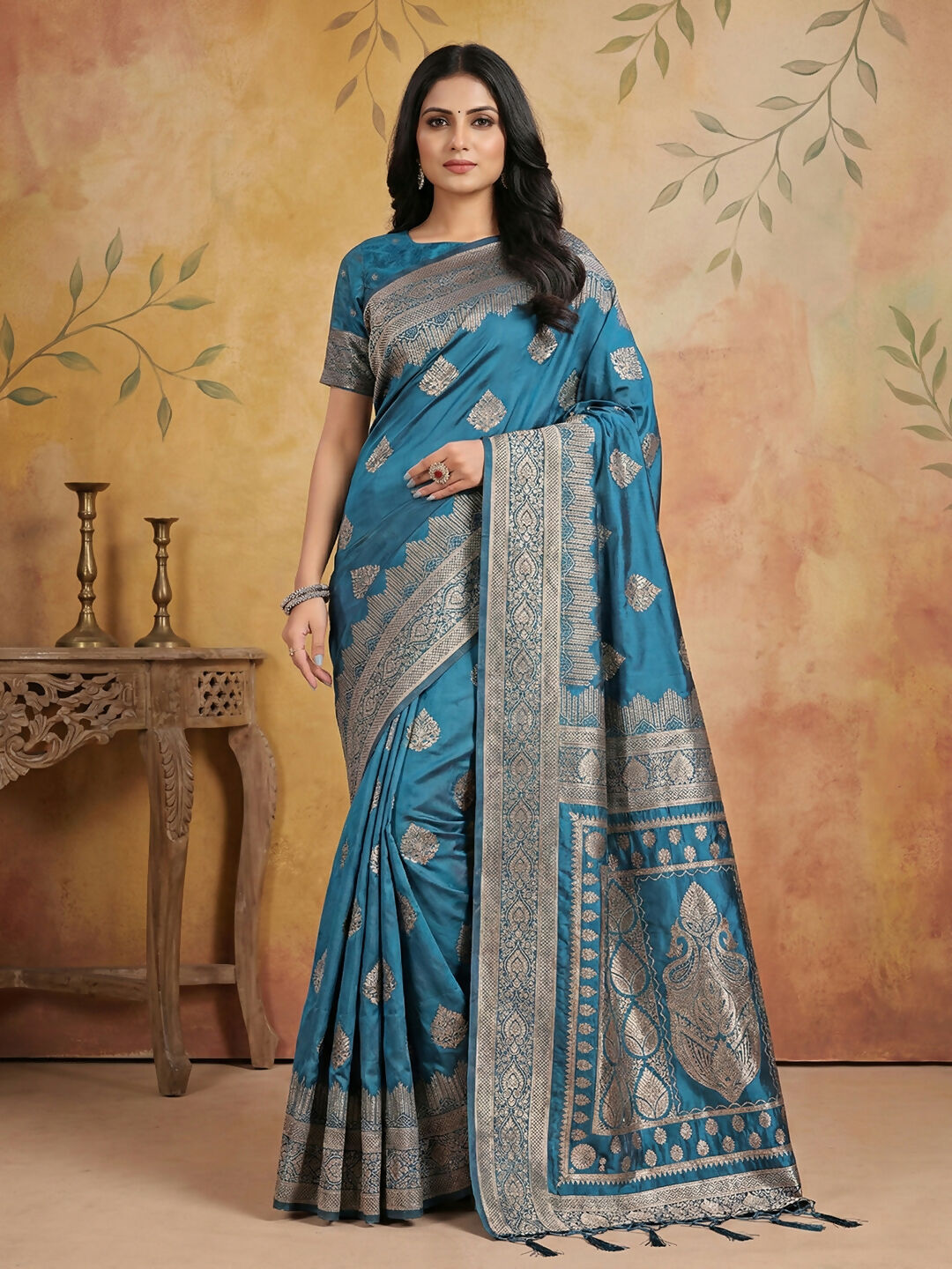 Elegant teal silk blend saree with matching blouse piece draped beautifully