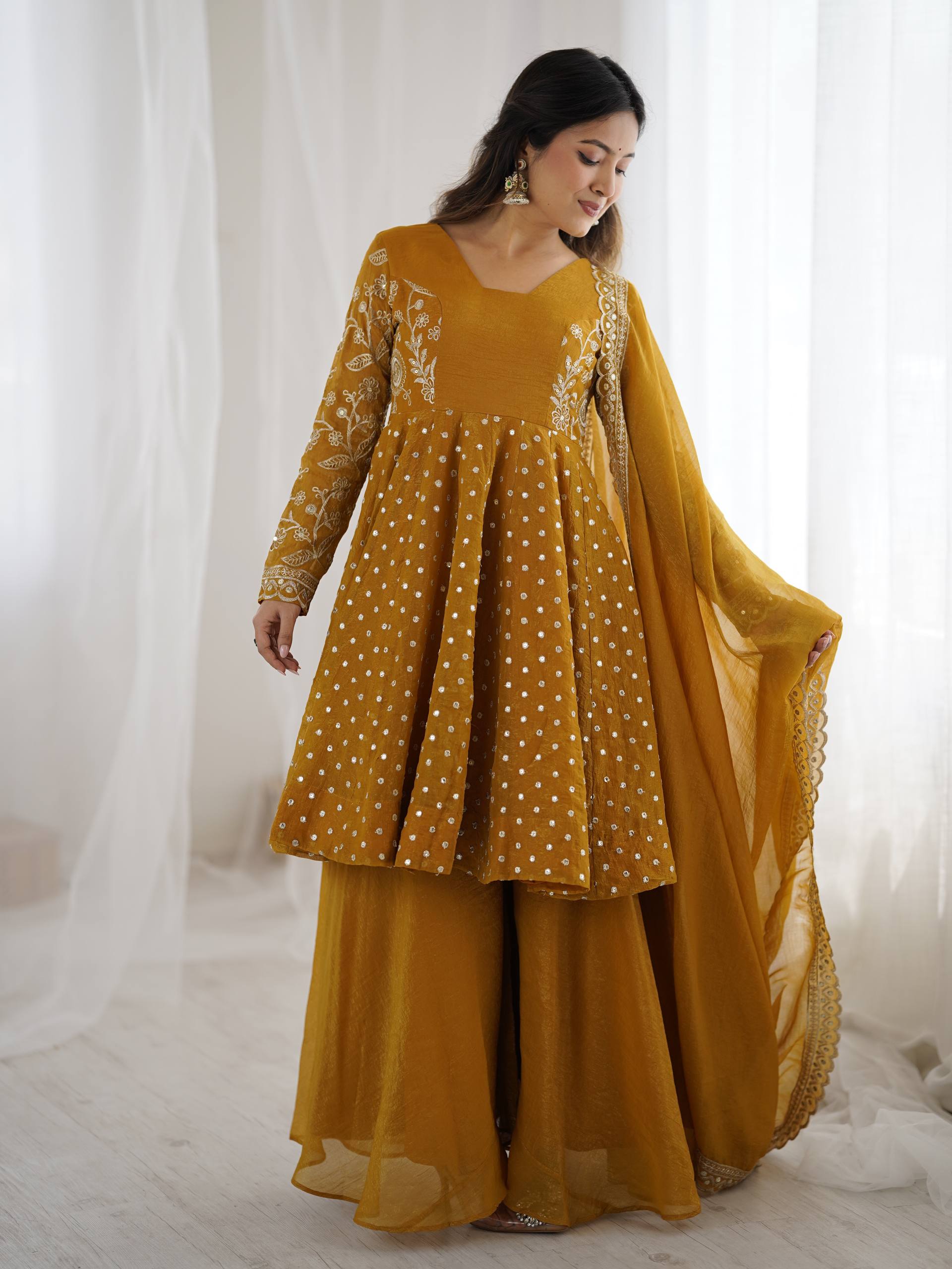Yellow Crunchy Silk sharara suit with intricate sequence embroidery and full sleeves
