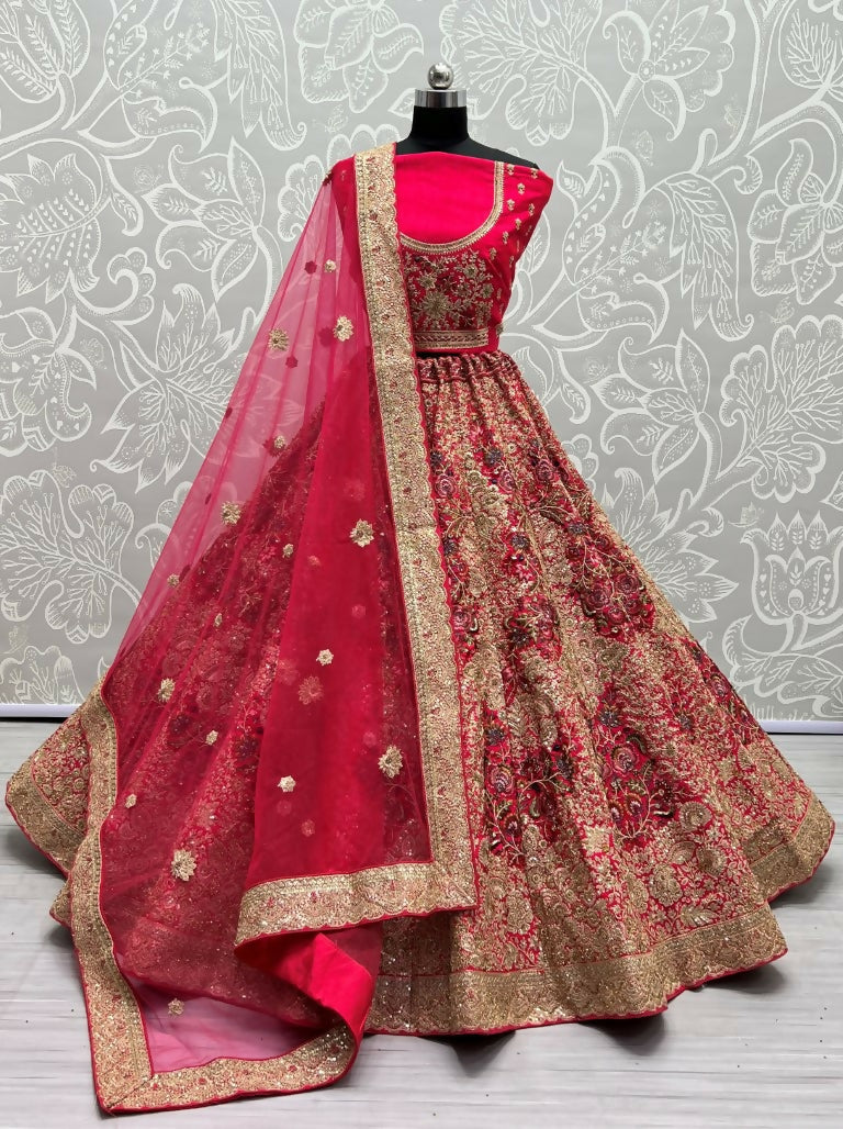 Woman wearing a Rani Pink Silk Lehenga with dori, sequins, and diamond embroidery for a wedding.
