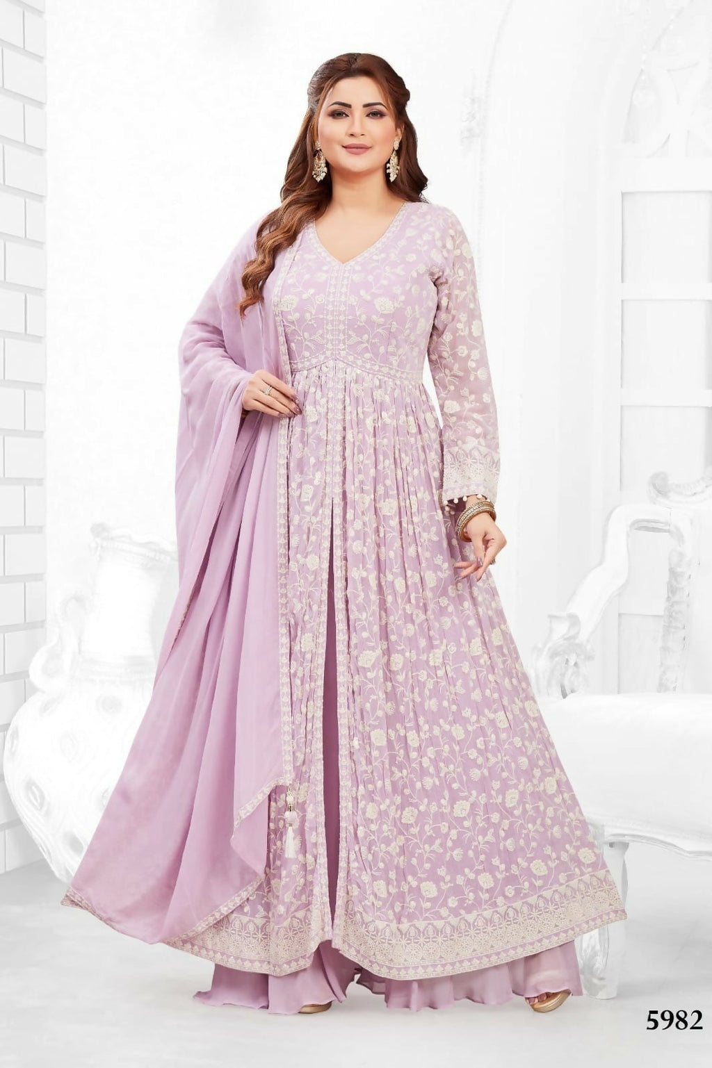 Model wearing a 3-piece lylac georgette kurta set with matching dupatta and cotton lining