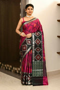 Elegant black and pink Kataan Ikkat saree with intricate woven anchal