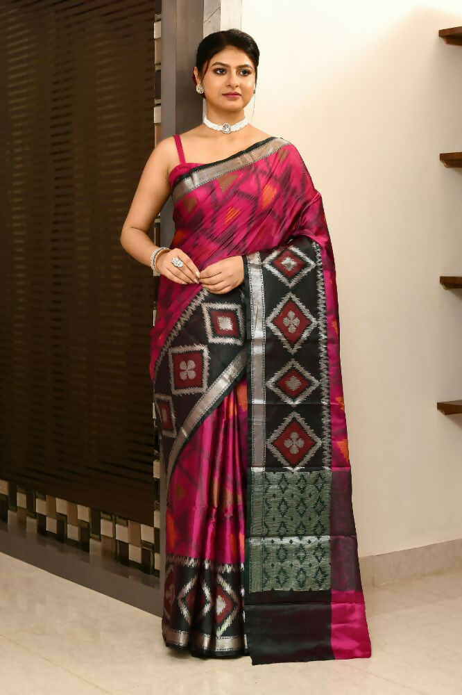 Elegant black and pink Kataan Ikkat saree with intricate woven anchal