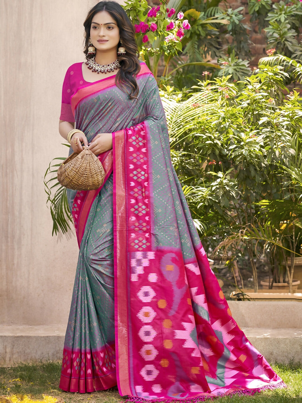 Grey Pochampalli silk saree featuring a contrasting purple blouse, elegant traditional attire.