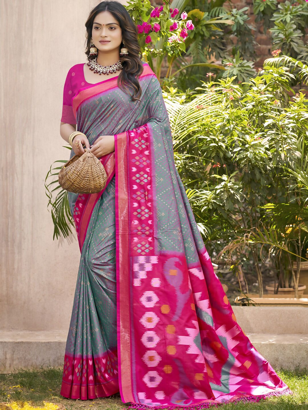 Grey Pochampalli silk saree featuring a contrasting purple blouse, elegant traditional attire.