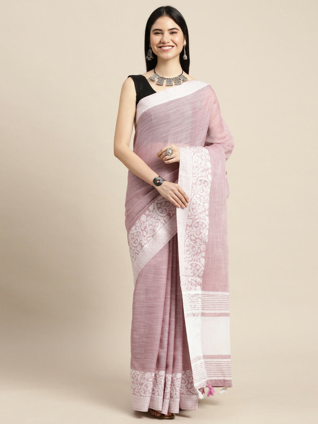 A elegant purple linen saree with matching blouse fabric, perfect for formal ethnic wear.