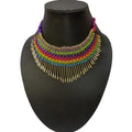 Vibrant traditional multicolor beads statement necklace with gold accents, styled in a bohemian aesthetic.