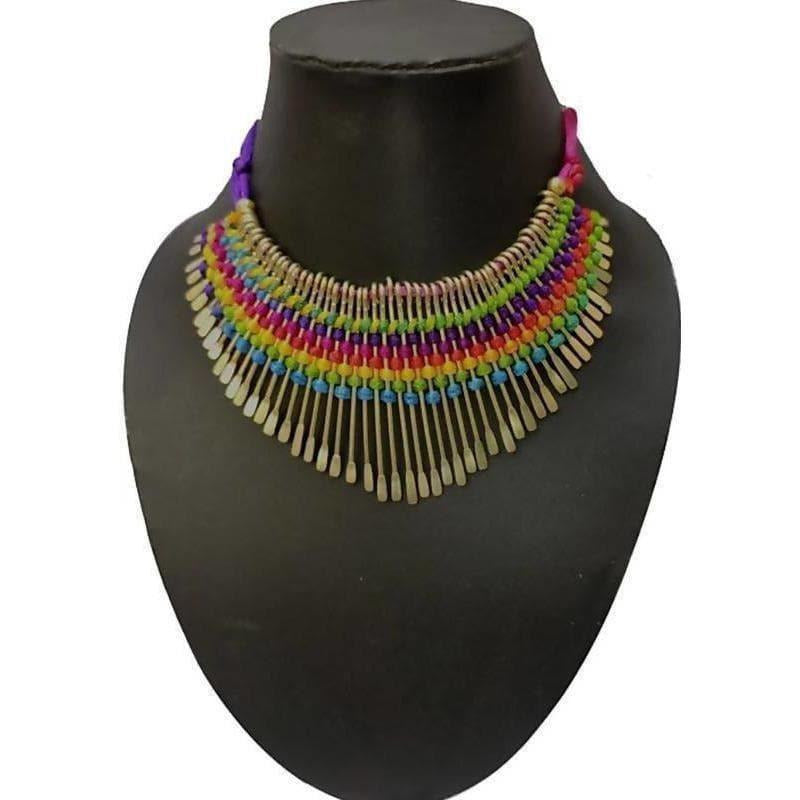 Vibrant traditional multicolor beads statement necklace with gold accents, styled in a bohemian aesthetic.