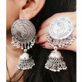 Silver oxidized jhumka earrings featuring a Lord Ganesh symbol