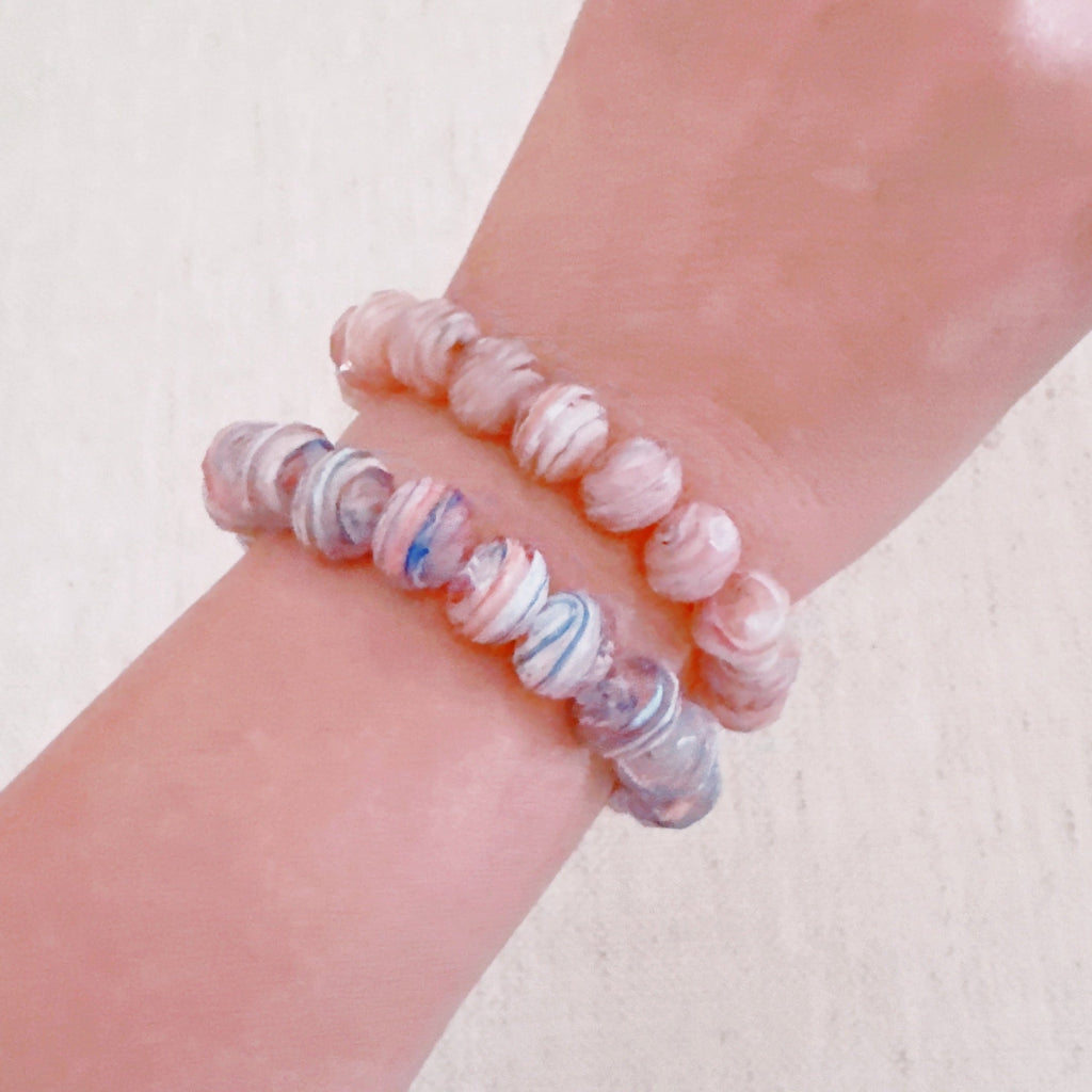 Close up of Zion Canyon stretch bracelet with marbled natural tone glass beads.