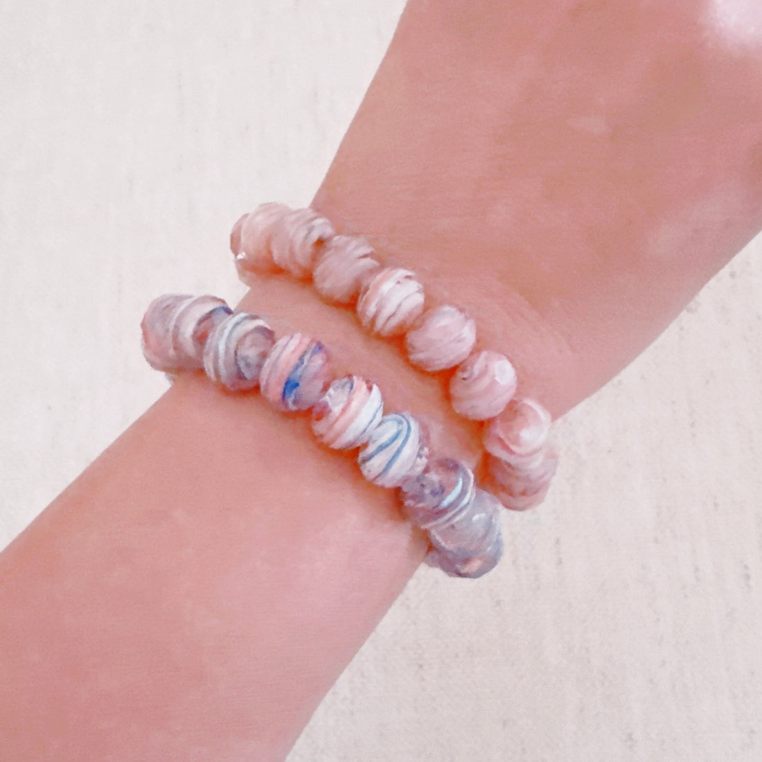 Close up of Zion Canyon stretch bracelet with marbled natural tone glass beads.
