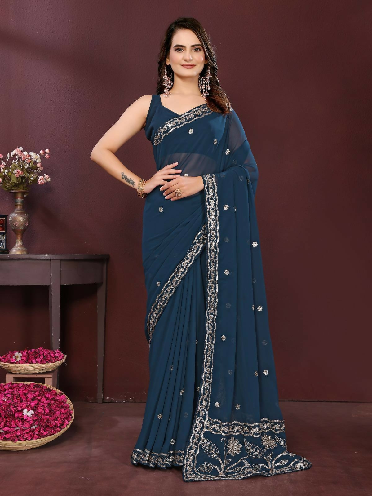 Teal soft georgette saree with detailed embroidery and matching blouse