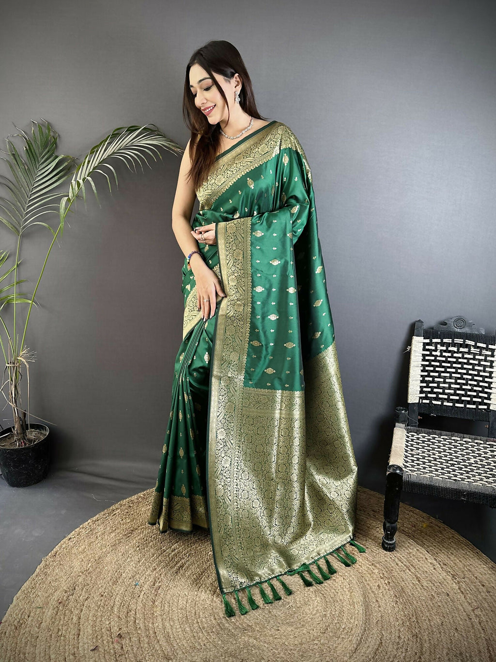 Green Banarasi silk saree with Zari weaving motifs and matching blouse piece