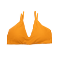 Model wearing a bright marigold orange Kinsley V-neck sleeveless cropped top with a twist-front design.