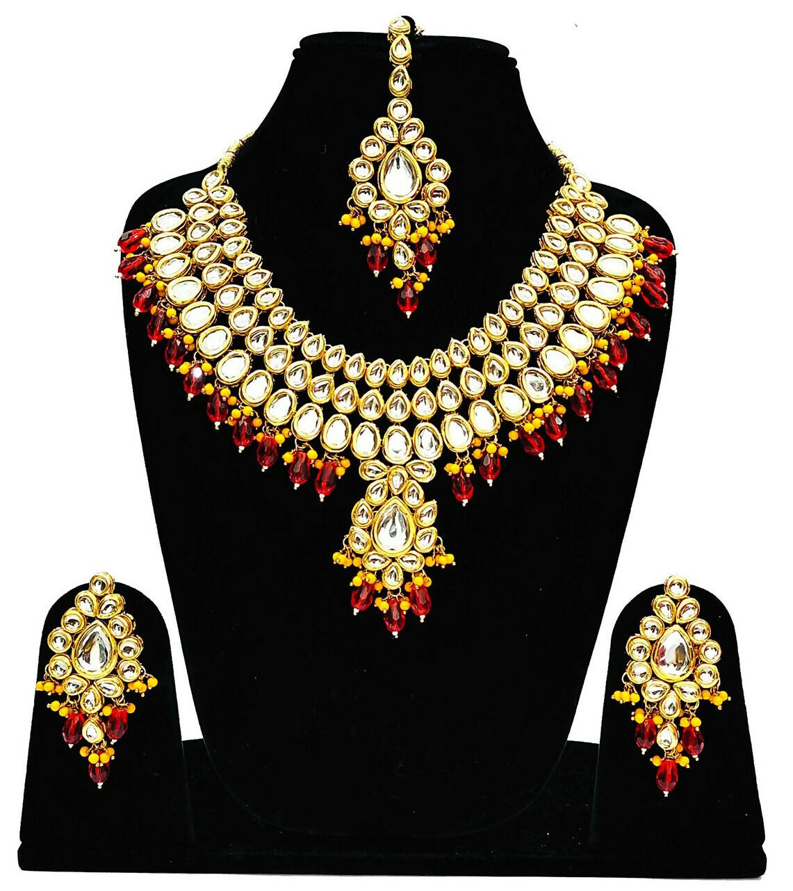 Exquisite handmade gold-plated Kundan jewellery set featuring vibrant red stones