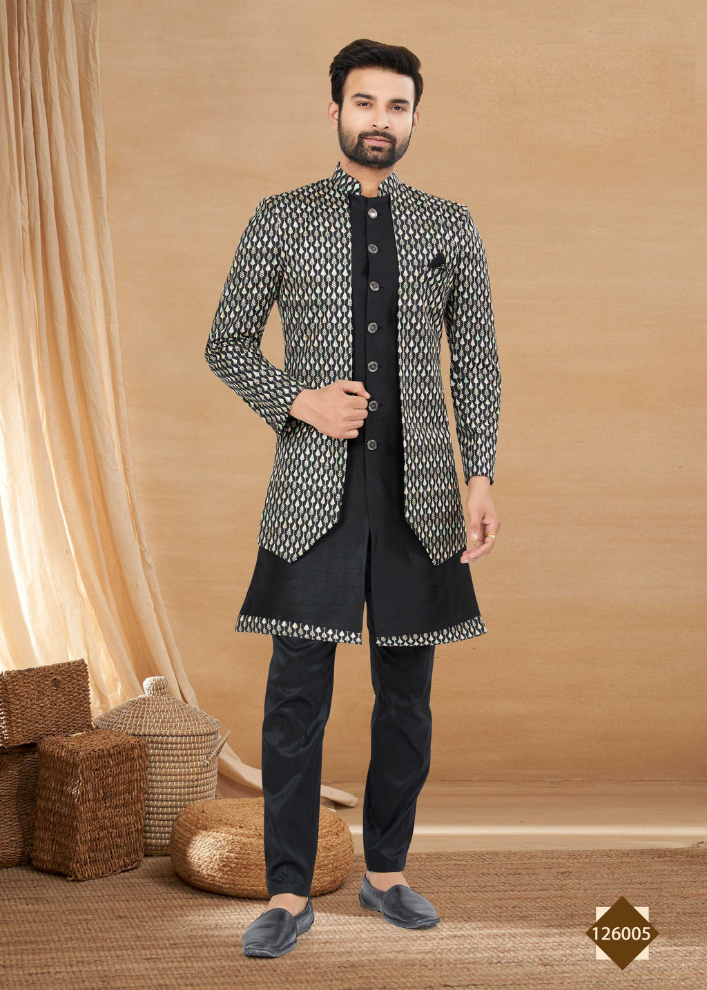 Men wearing a black heavy art silk double finish Indowestern kurta, pyjama, and jacket set.