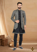 Men wearing a black heavy art silk double finish Indowestern kurta, pyjama, and jacket set.