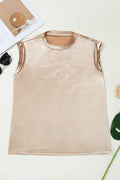 Model wearing a metallic round neck tank top with a luminous finish for a party look.