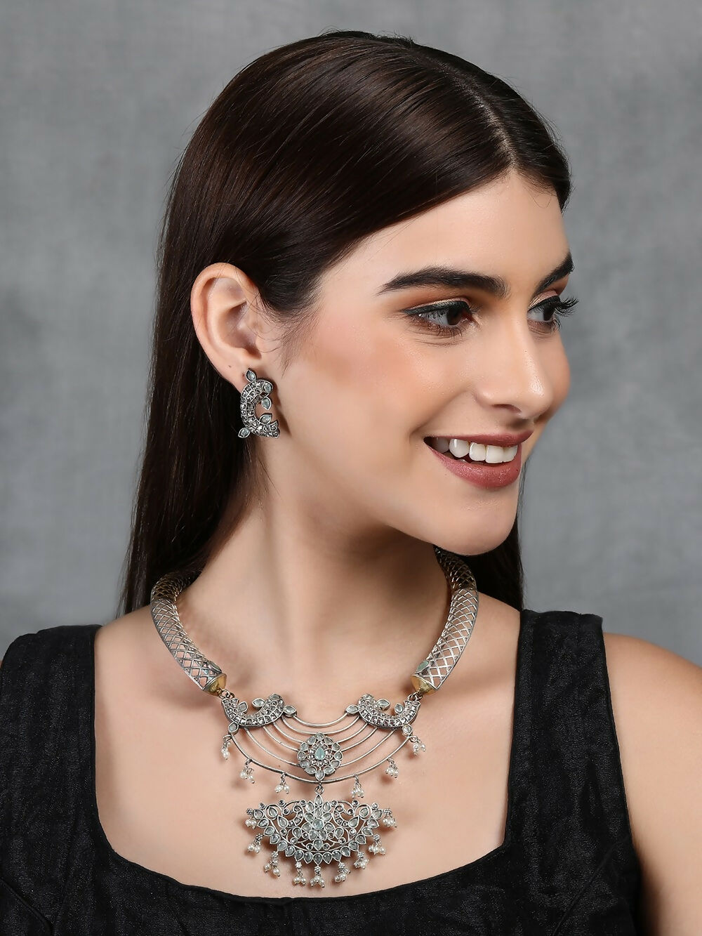 Handcrafted bohemian dual-tone choker necklace and earring set with blue stones and pearl accents