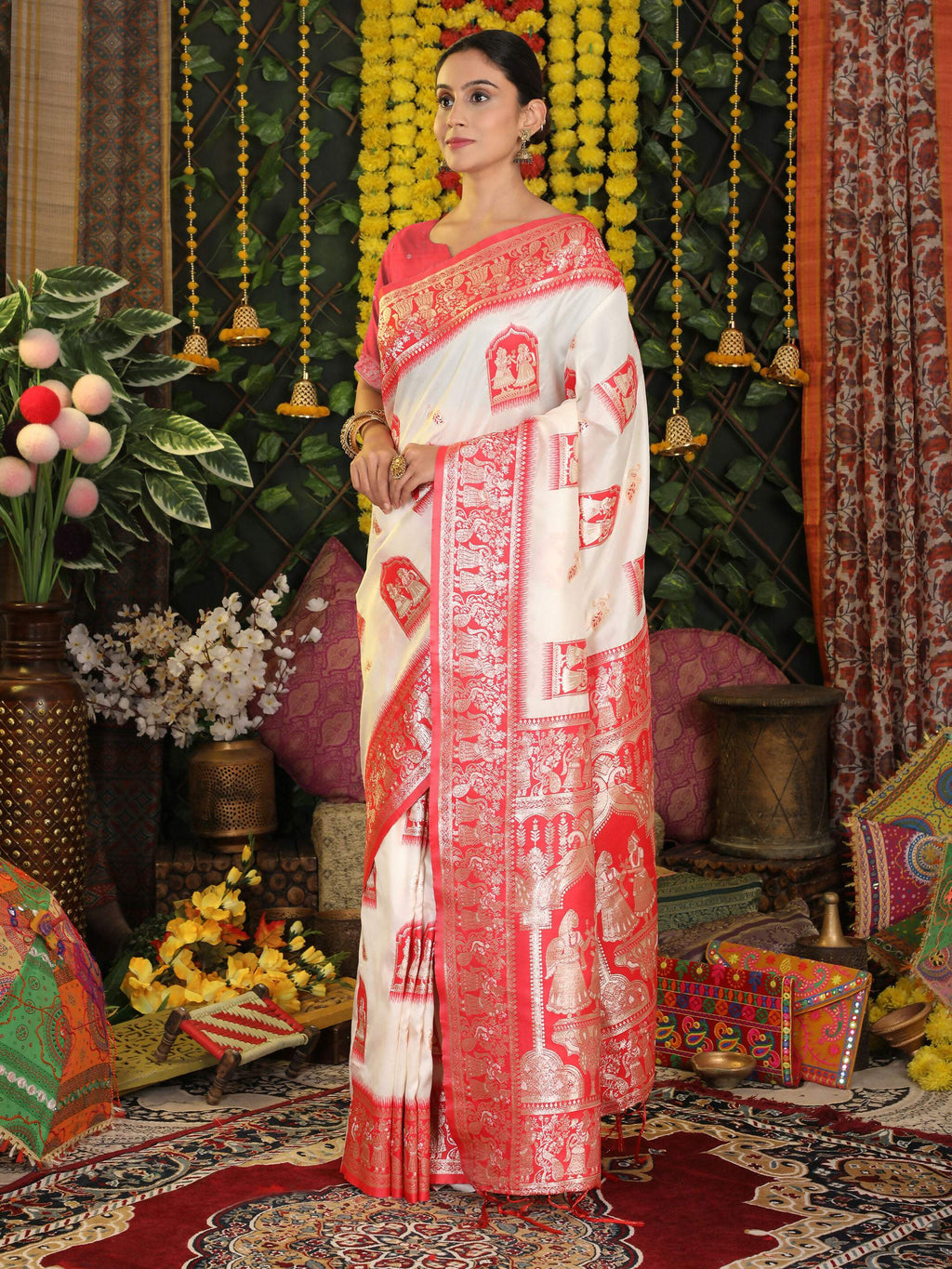 Elegant white silk saree with a vibrant red blouse, perfect for festive occasions.