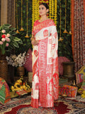 Elegant white silk saree with a vibrant red blouse, perfect for festive occasions.