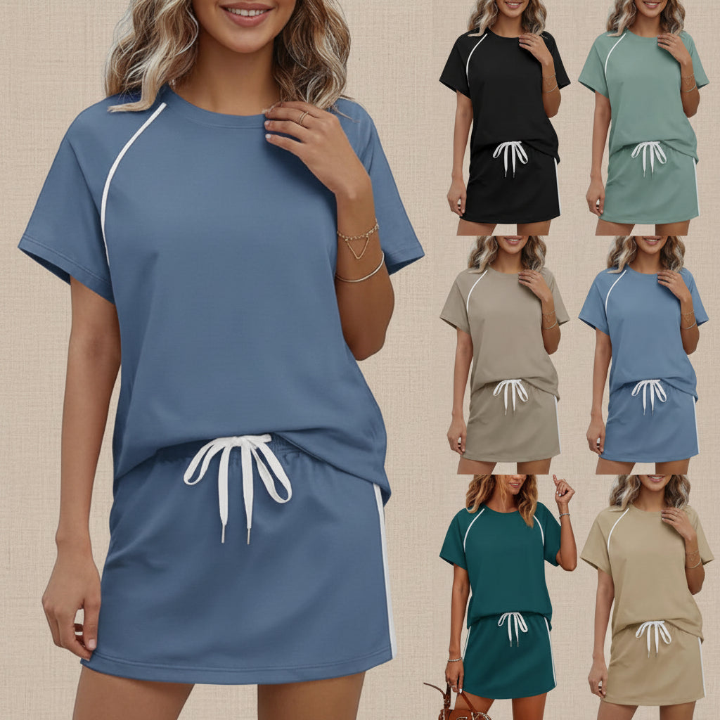 A woman wearing a solid color drawstring short-sleeve top and mini skirt set.