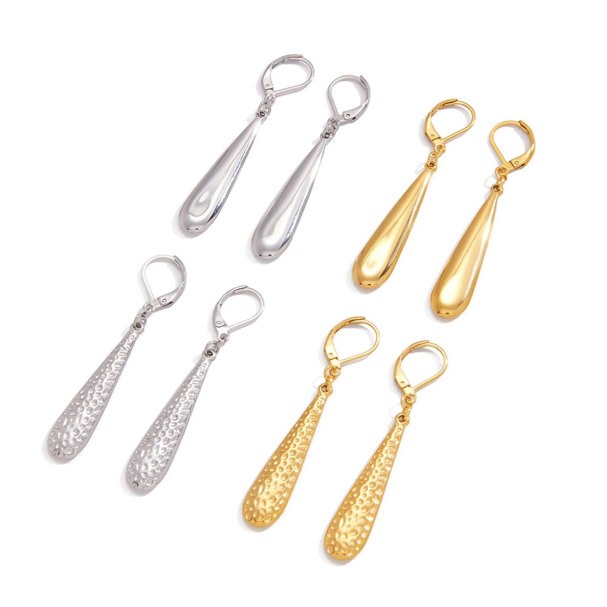 Minimalist teardrop earrings in polished 18K gold on a neutral background