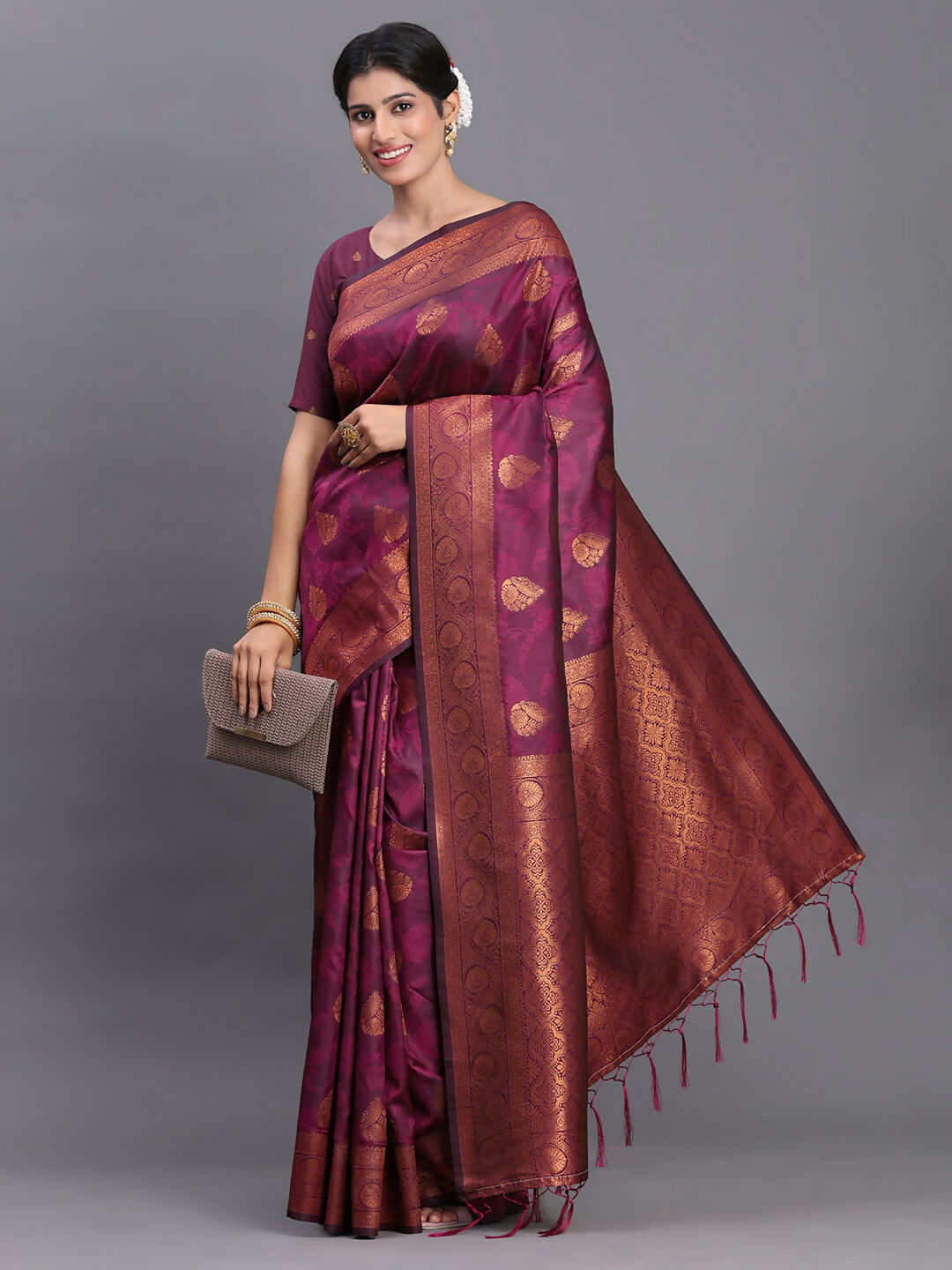 Regal purple silk saree with matching blouse, featuring a luxurious finish