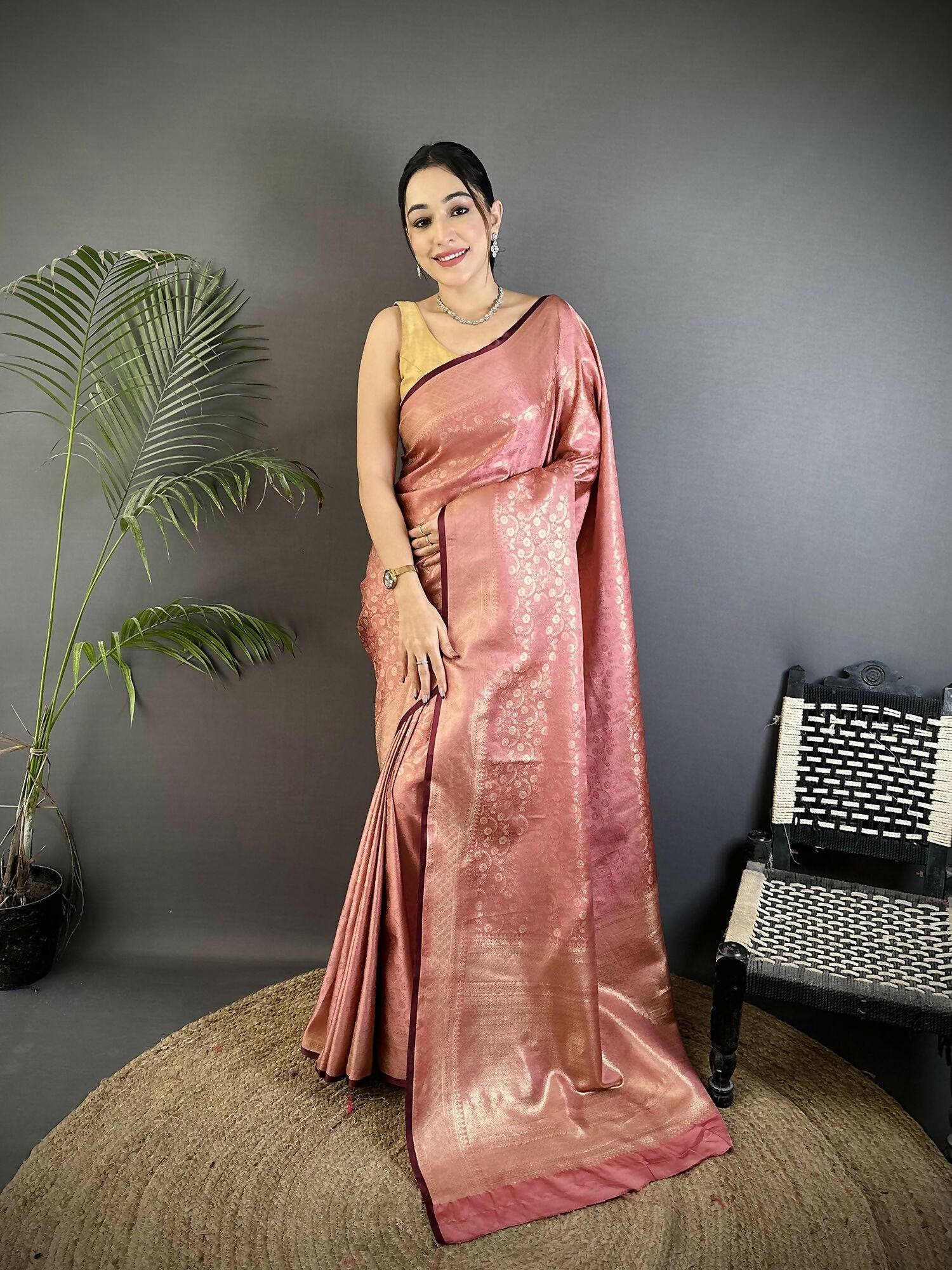 Dusty pink soft satin silk Banarasi saree with floral and paisley patterns