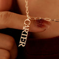 Customized cursive nameplate necklace on a high-quality chain, minimalist design.