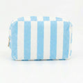 Small blue striped terry cloth cosmetic pouch with a top zipper closure
