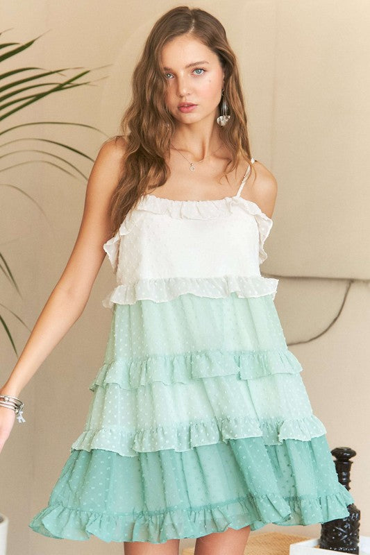 An elegant Adora Swiss dot chiffon mini dress with tiered ruffles