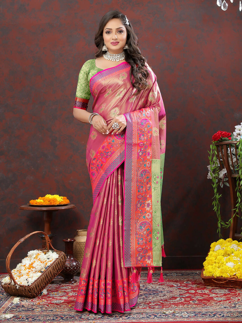Magenta Kanjivaram silk saree with gold zari woven detailing draped elegantly