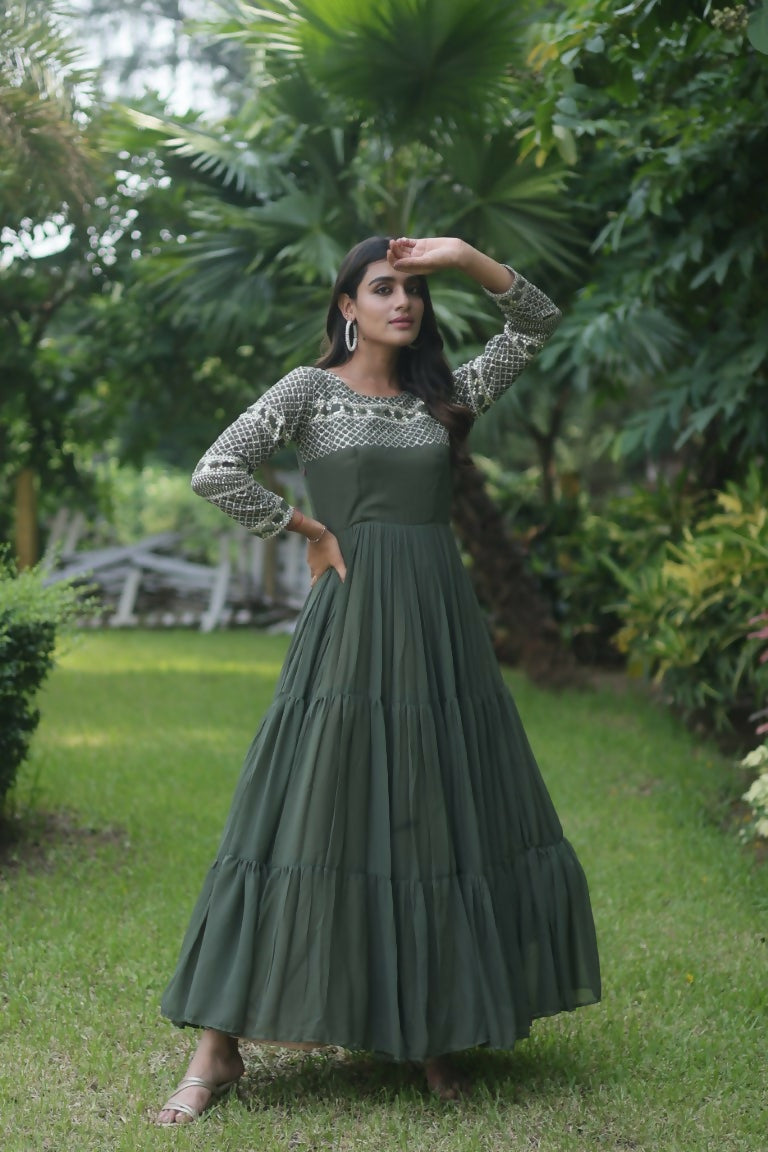 A floor-length Mehendi Green faux georgette Anarkali dress with silver sequins and zari embroidery.