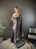 A elegant black Meenakari Banarasi silk saree with vibrant woven patterns and an unstitched blouse piece.