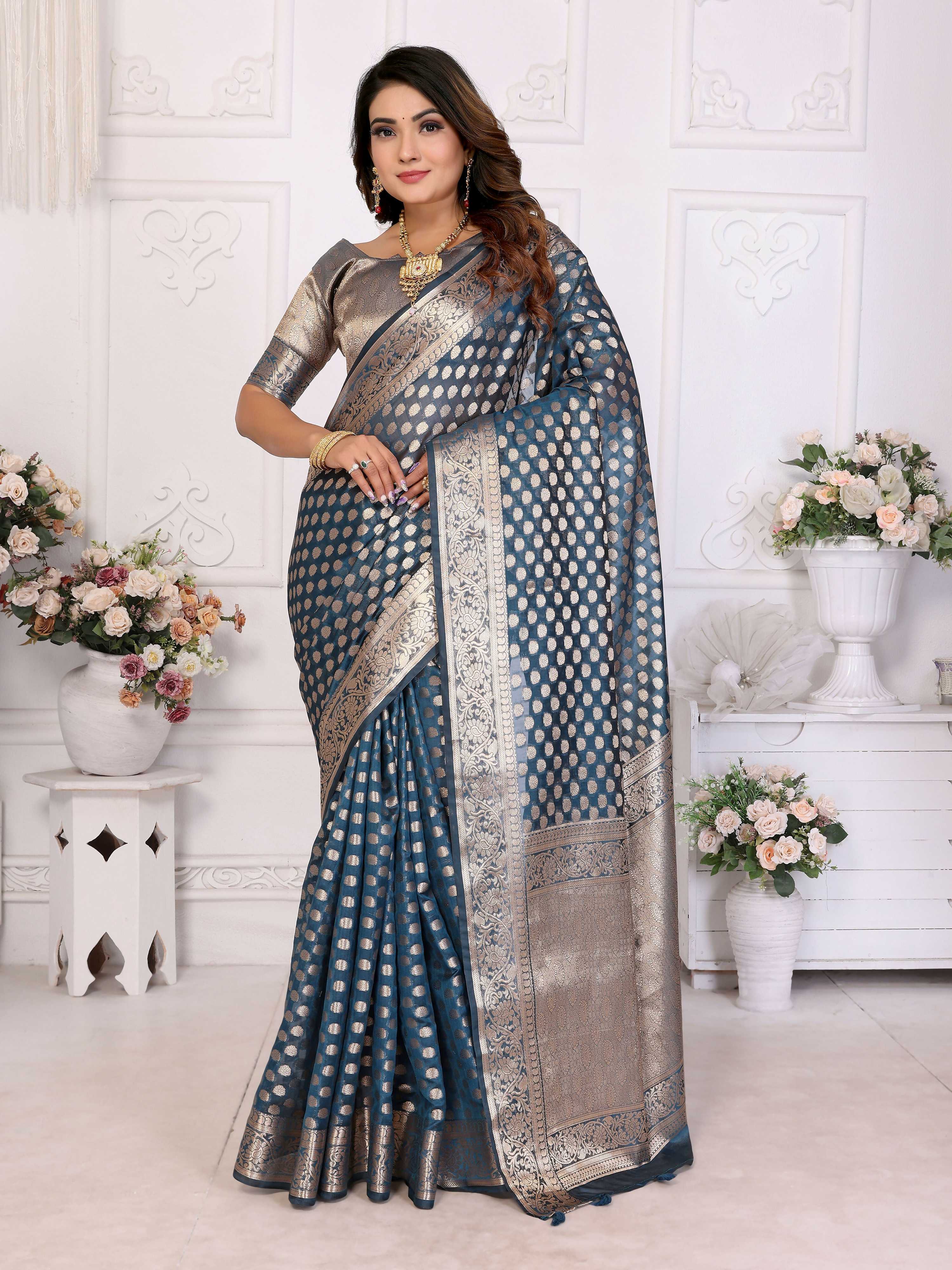 Teal Organza Silk saree with traditional weaving patterns
