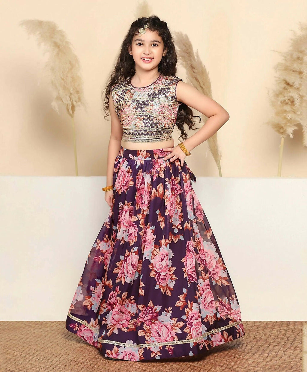 A beautiful wine-colored tabby silk lehenga choli set for girls.