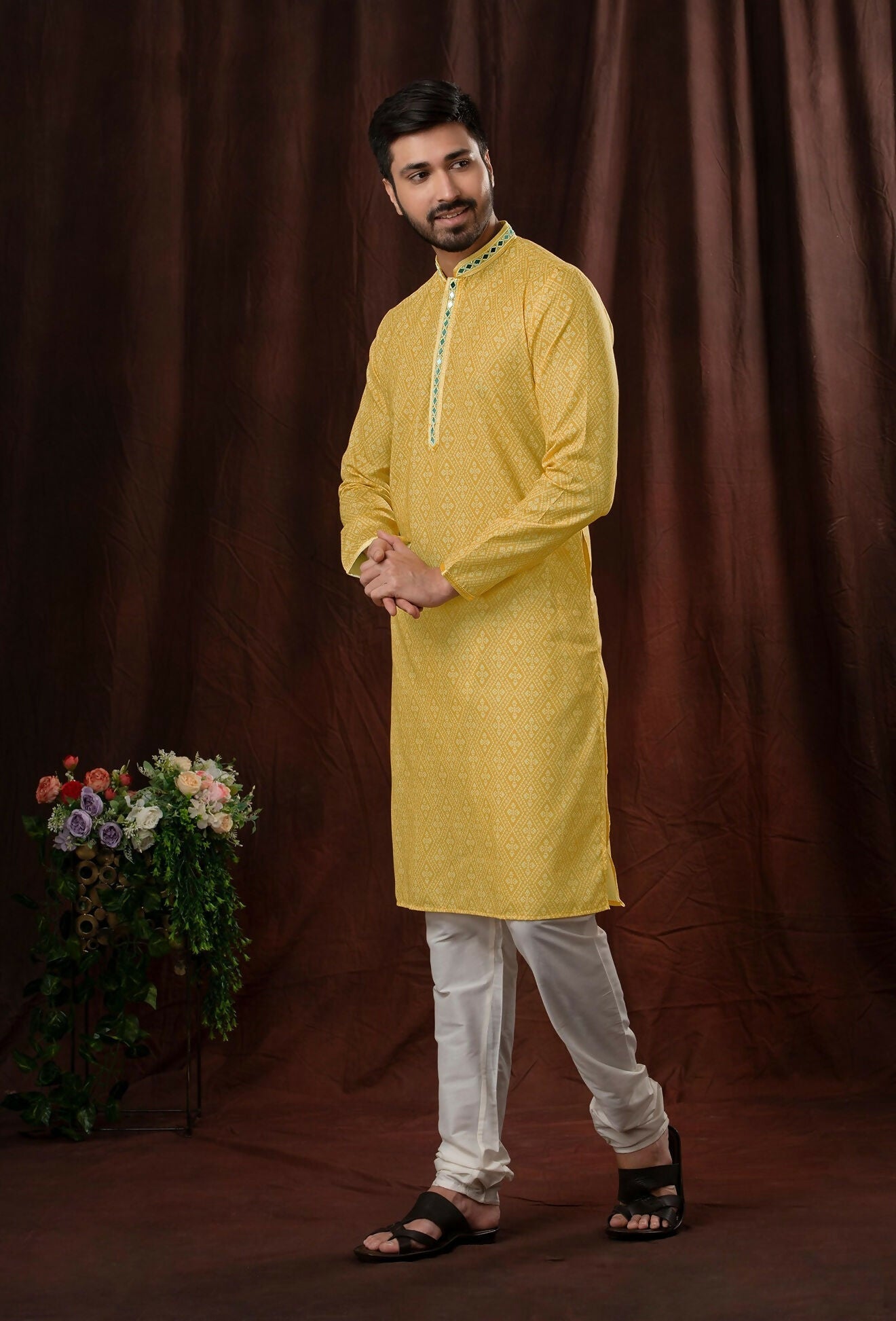 Light yellow art silk kurta paired with off-white pyjama pants