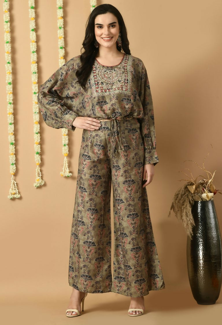 Model wearing a deep green Maslin kurta set with matching bottom