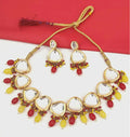 Gold-plated Kundan stone jewellery set on a luxury display