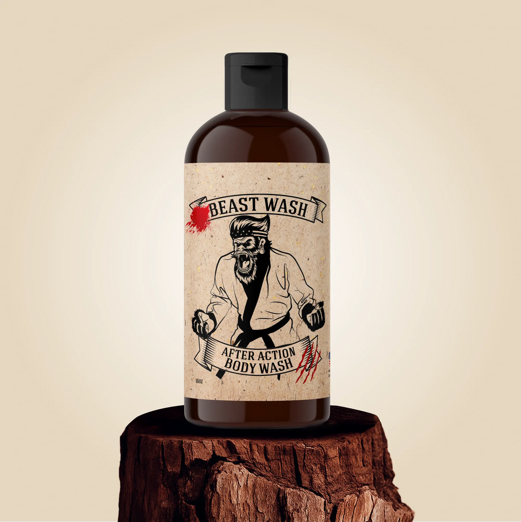 A 16oz bottle of Johnny Slicks After Action Body Wash on a tree stump with a label showing a graphic of a beast in a martial arts gi.