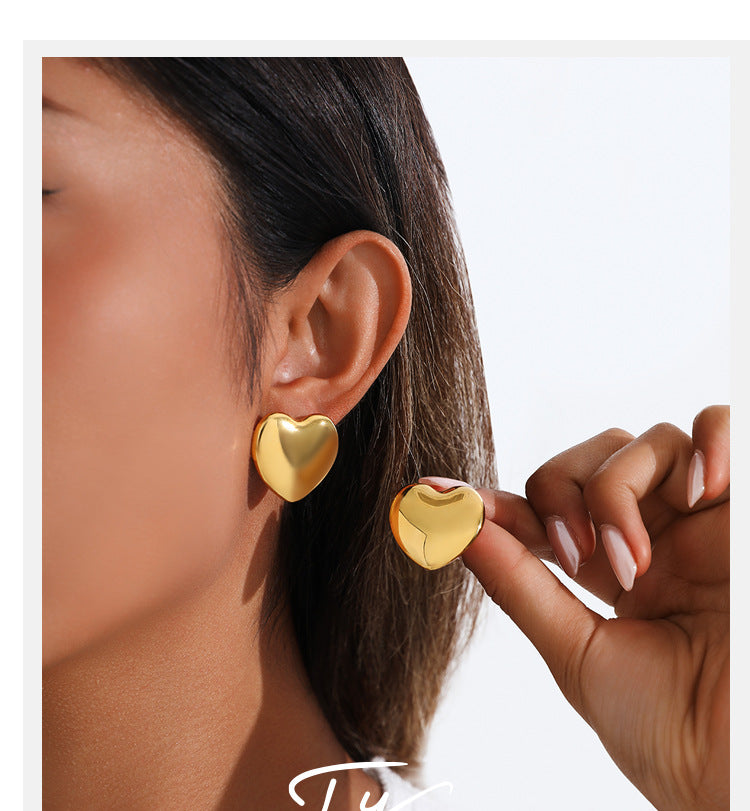 European And American Minimalist Glossy Heart-shaped Stainless Steel Earrings For Women. Light Luxury Minimalist Style. Exaggerated Heart-shaped Earrings. Versatile Accessories.