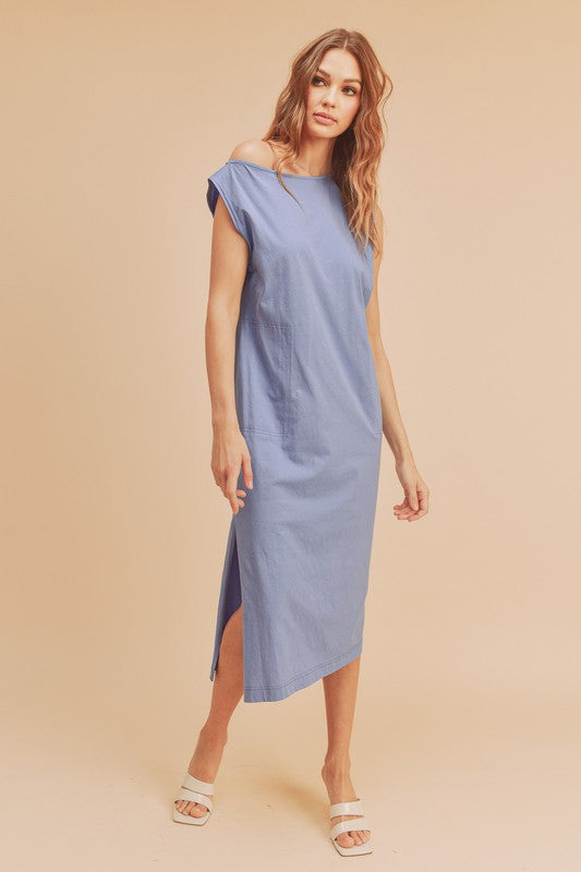 Sleeveless midi dress with a round neck and side slits for a modern, effortless silhouette.