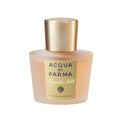 Elegant glass bottle of Acqua di Parma Magnolia Nobile Hair Mist in gold and peach hues.