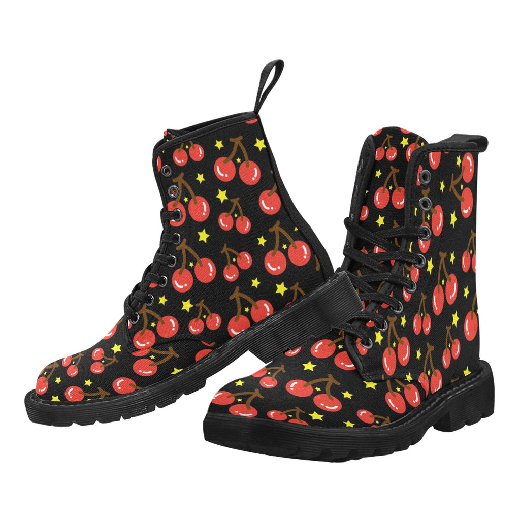 Pair of women's black canvas lace-up combat boots with an all-over red cherry and yellow star pattern, against a white background.