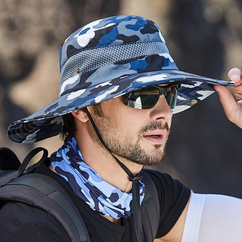 Men's camo bucket hat with wide brim and breathable mesh in outdoor setting