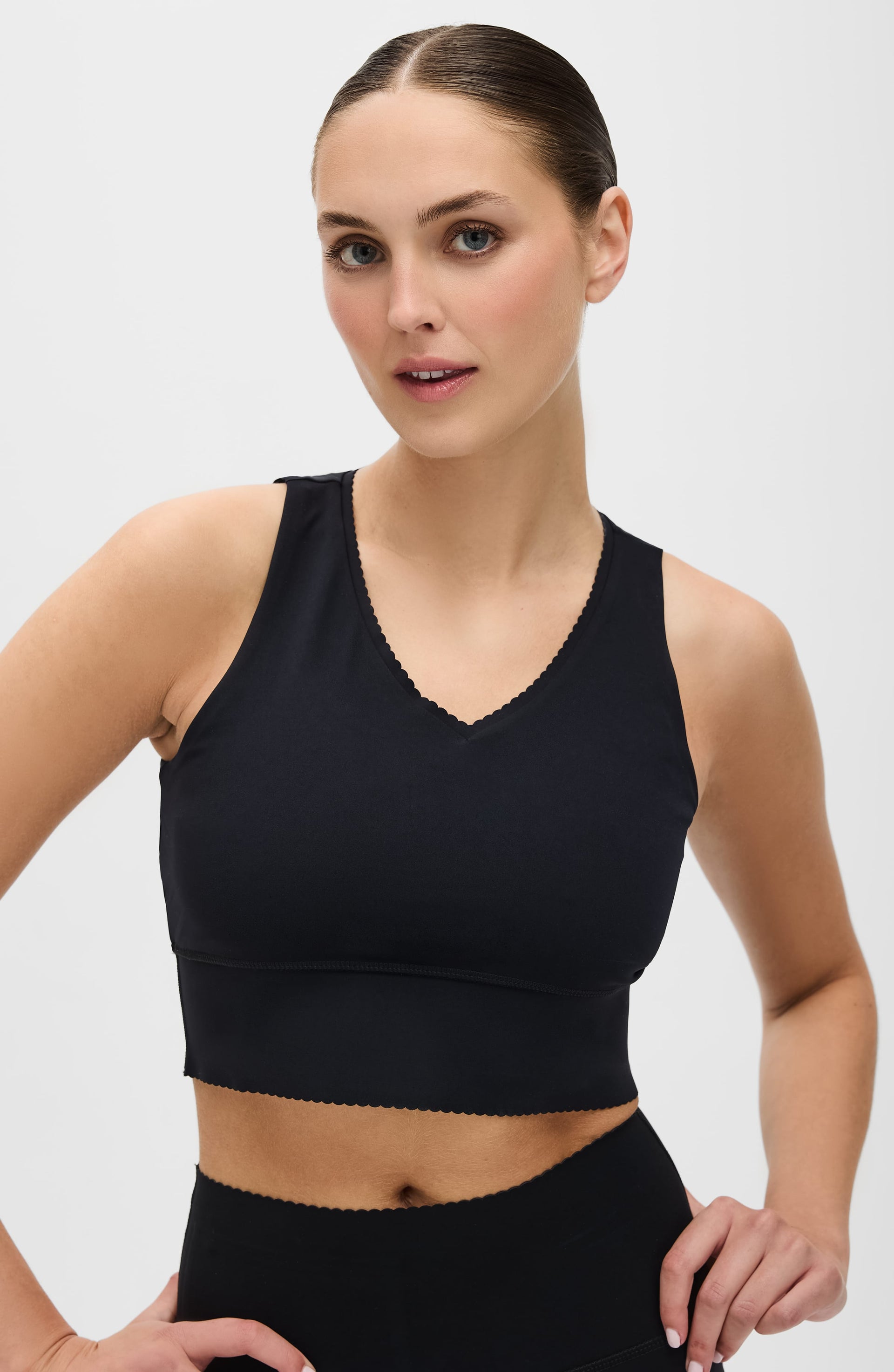 Minimalist Adorn sports bra in black and brown, perfect for athleisure styling