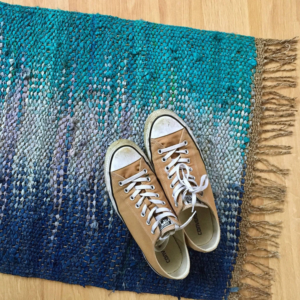 Adriatic Pools Throw Rug weaving kit laid out on a table with weaving tools