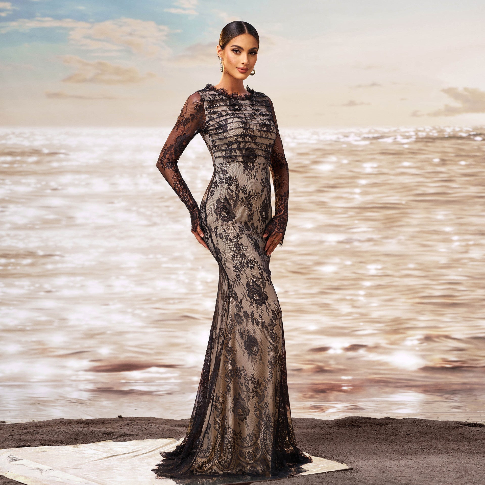 Black long-sleeve sheath fishtail evening dress with sequin details and high-waist cut.