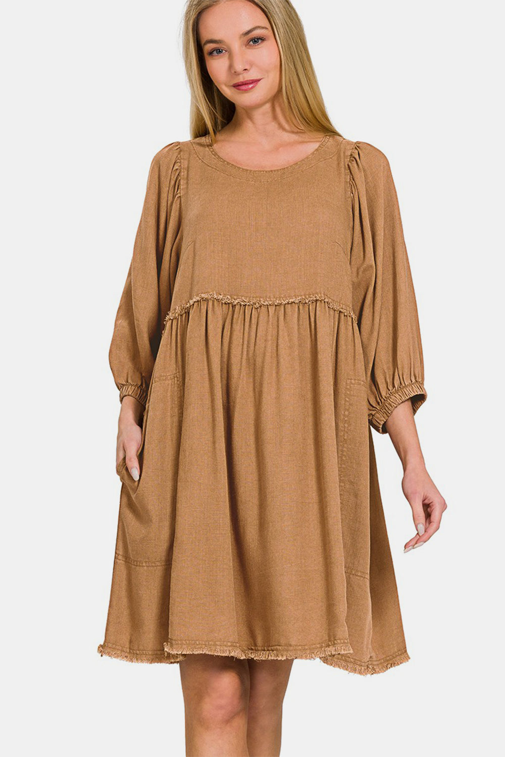 Washed linen babydoll dress featuring puff sleeves and pleated detailing